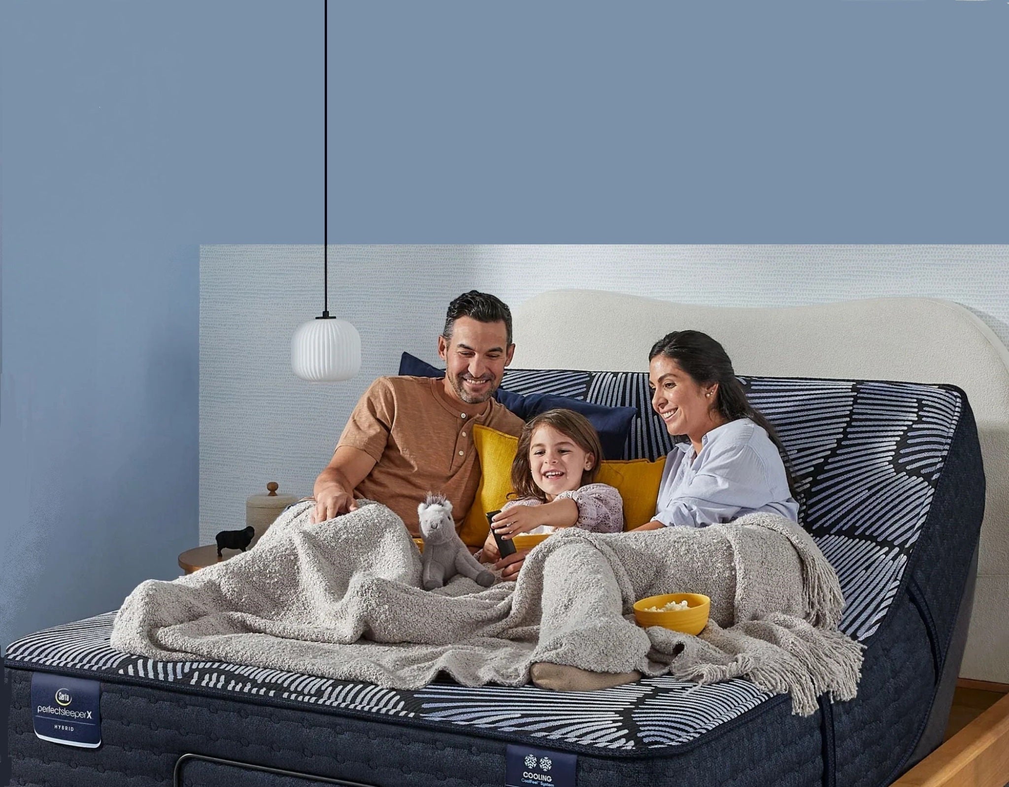 Family relaxing on adjustable mattress