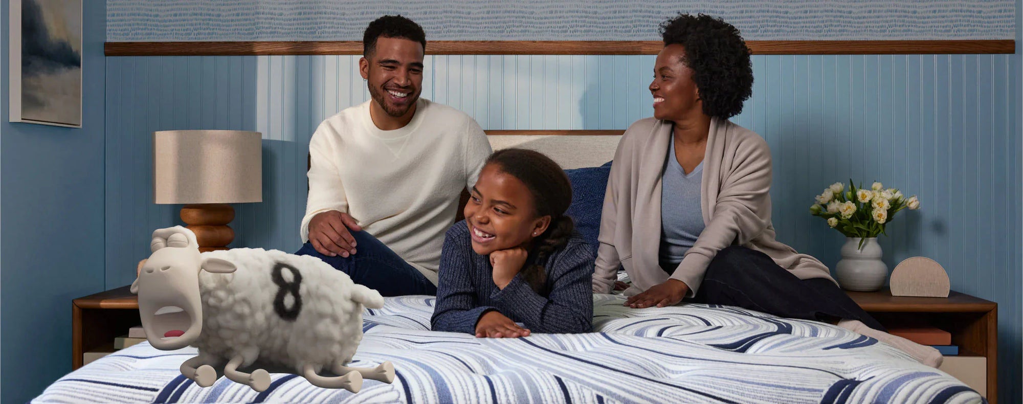 Family with animated sheep on bed