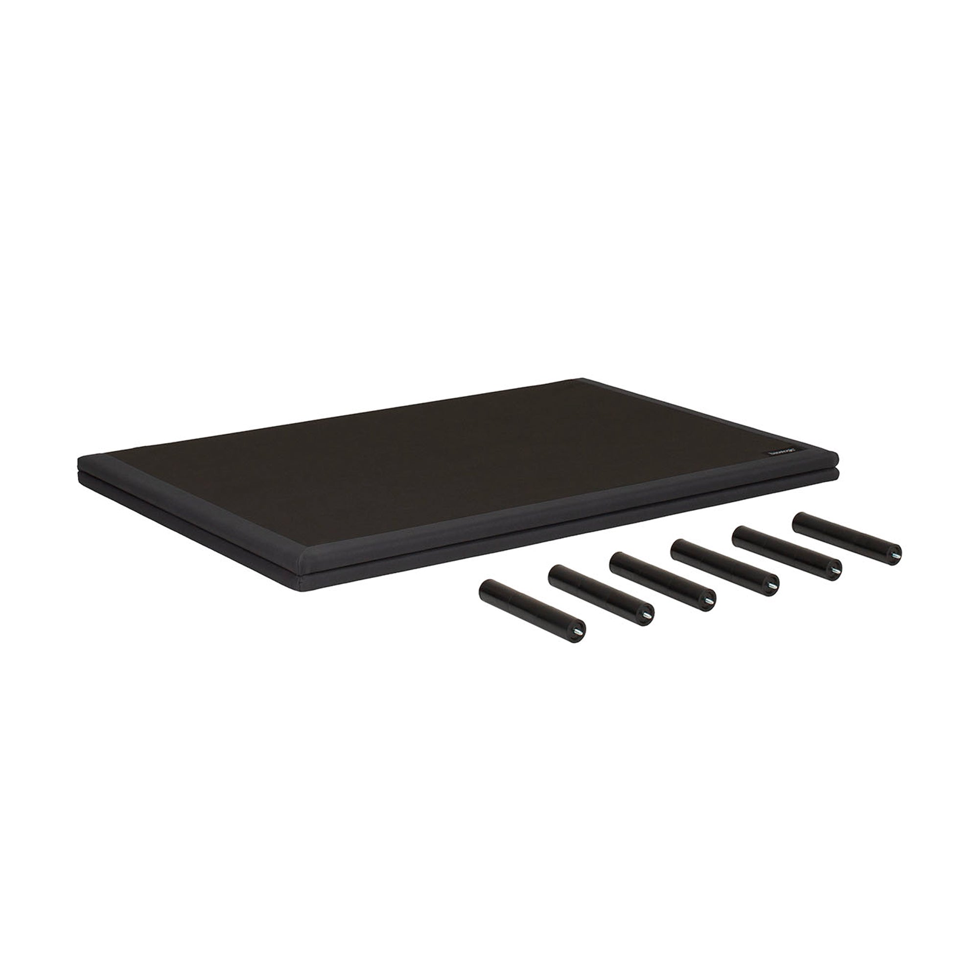 A black rectangular mat or pad shown on a plain white background, with five black cylindrical pieces placed in front of it.
